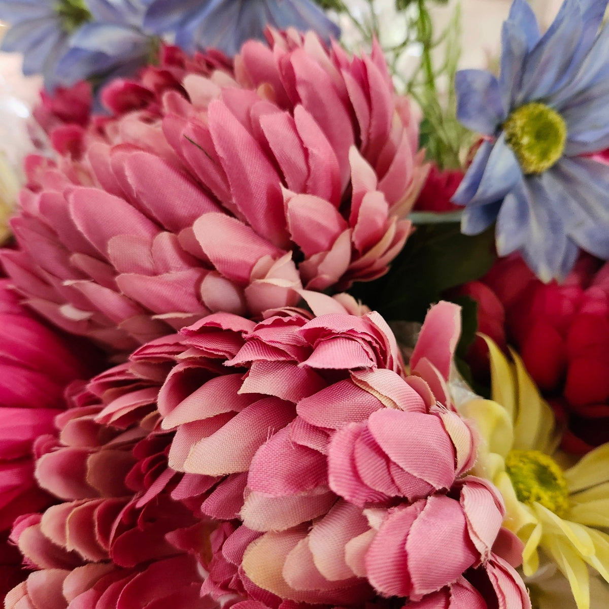 Artificial peony in deep pink, one of five shades made, lifelike enough to sit among fresh flowers in a vase