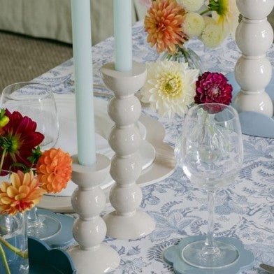 White bobbin candlestick from Inside Living, turned decorative candle holder for dining and home display, side view