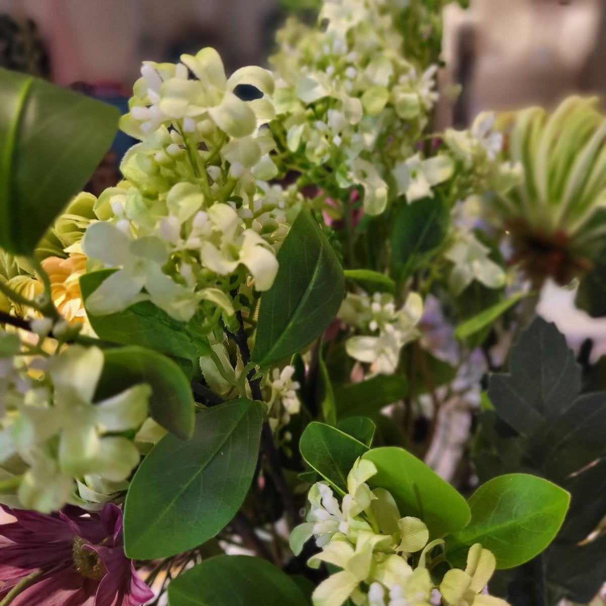 Lifelike artificial jasmine with delicate flowers in cream, green, white, blue or red for displays