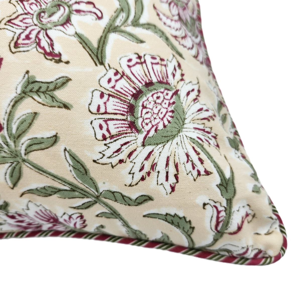 Summer block print cushion cover finished with toning striped piping around the edges, in pink, green and cream