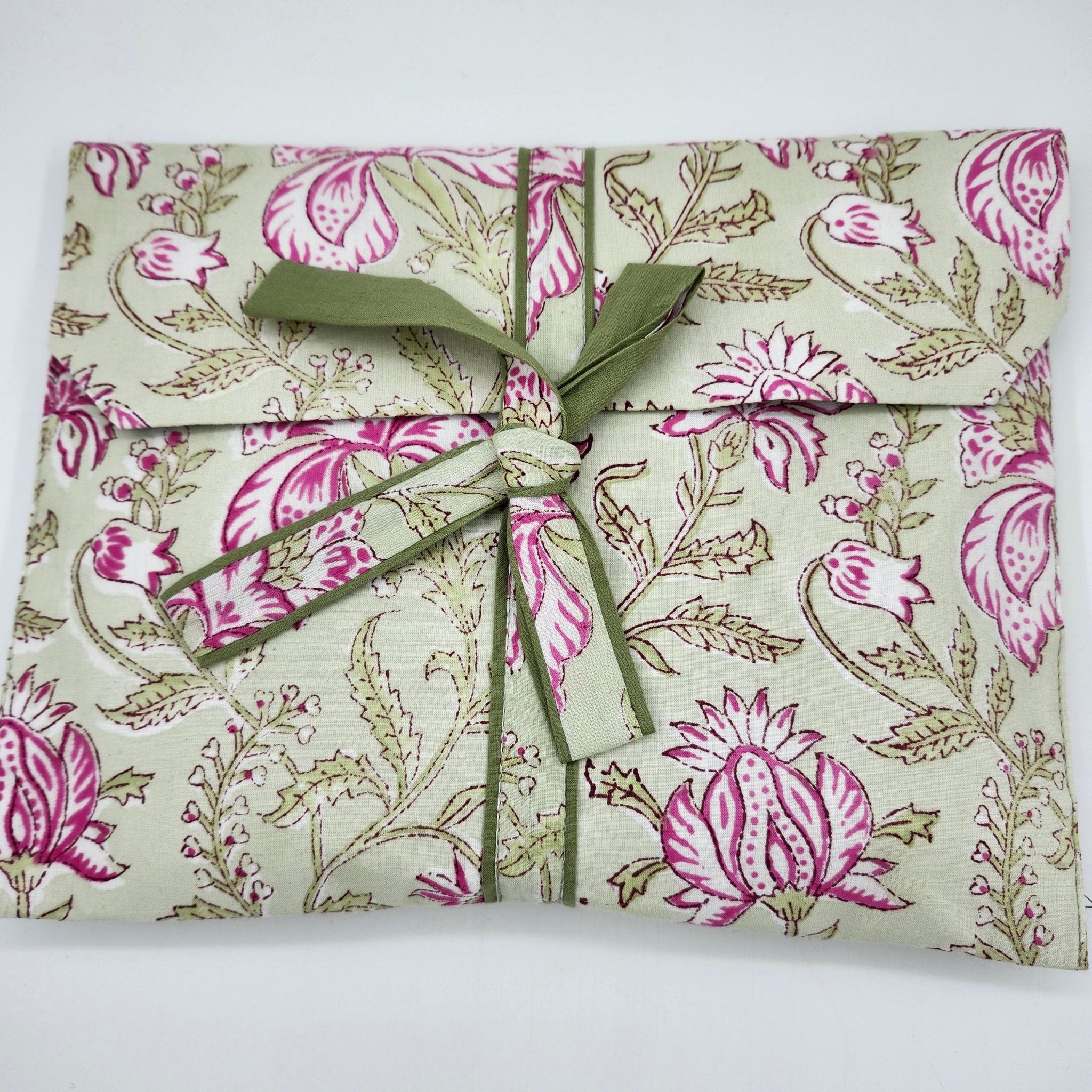Cotton short pyjama set with a pink floral block print on pale green, short-sleeved top and drawstring shorts