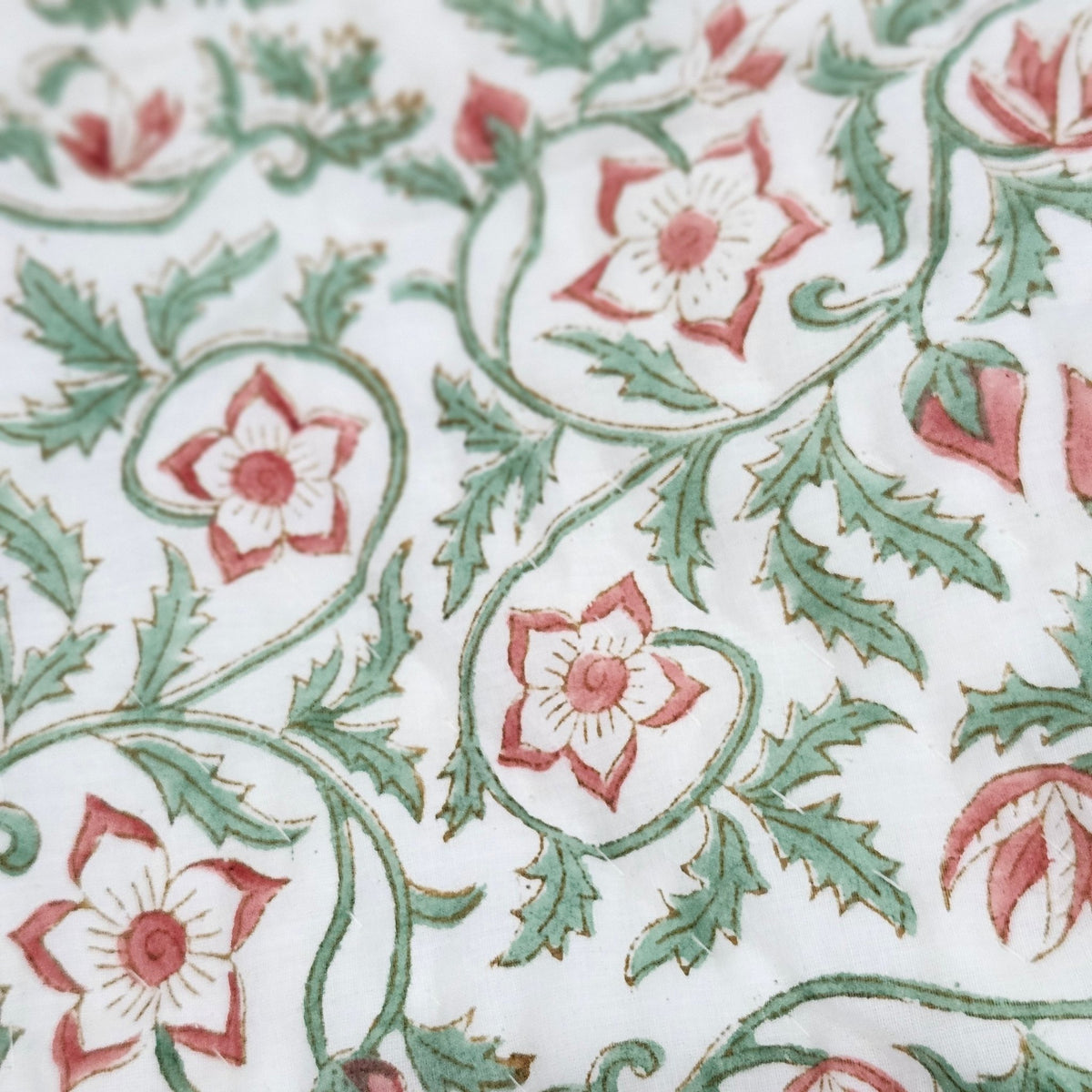 Reversible green trellis block print single quilt, made with carved wooden or brass blocks on cotton
