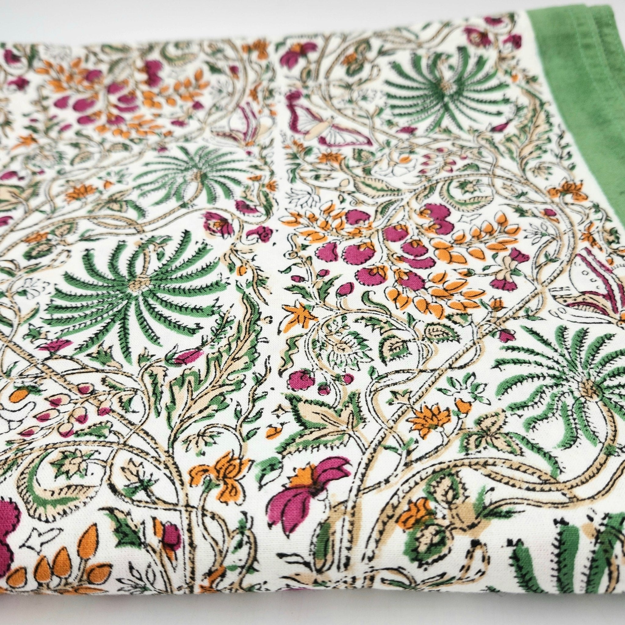 Rainforest design block print cotton tablecloth in multicolour on olive, 225 x 150 cm