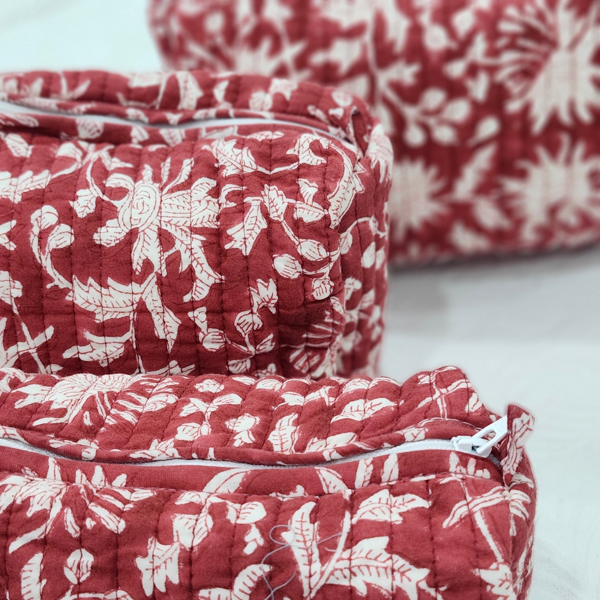 Block print cotton wash bag in festive red, handmade toiletry and travel pouch for bathroom essentials, detail view