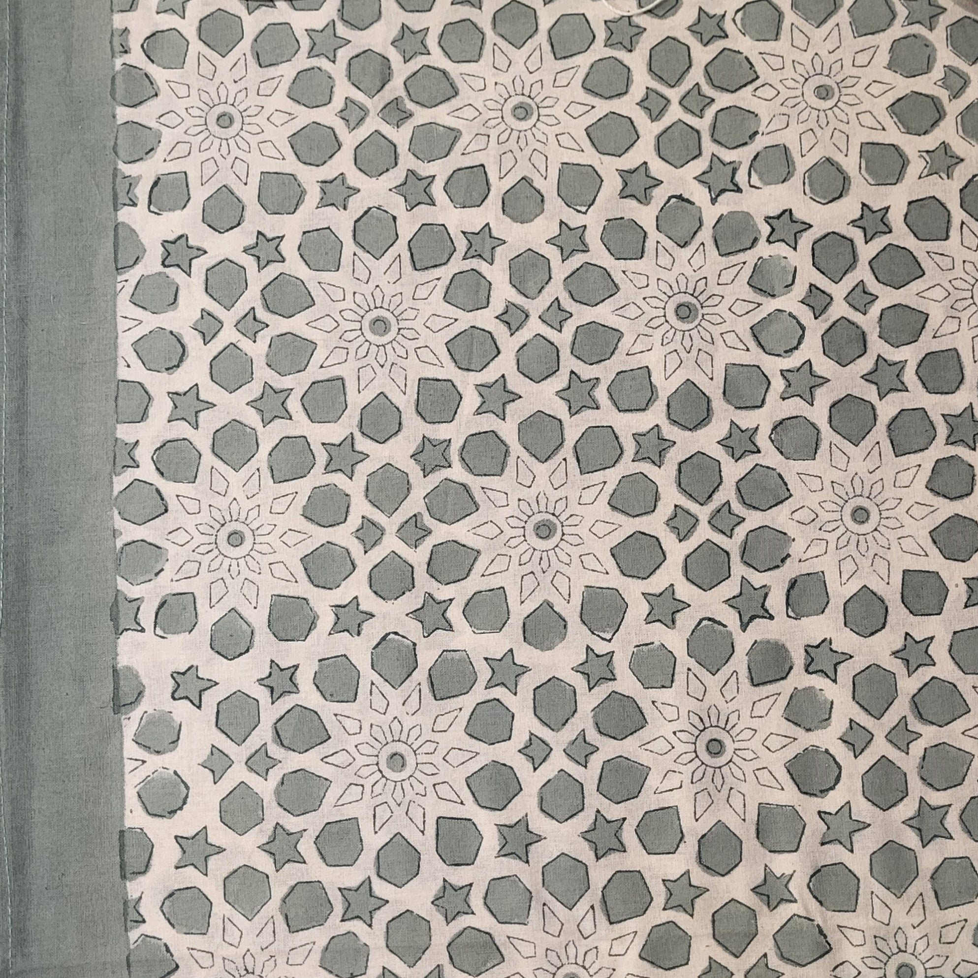 Bluey-green cotton tablecloth block-printed with floral and geometric motifs, machine washable