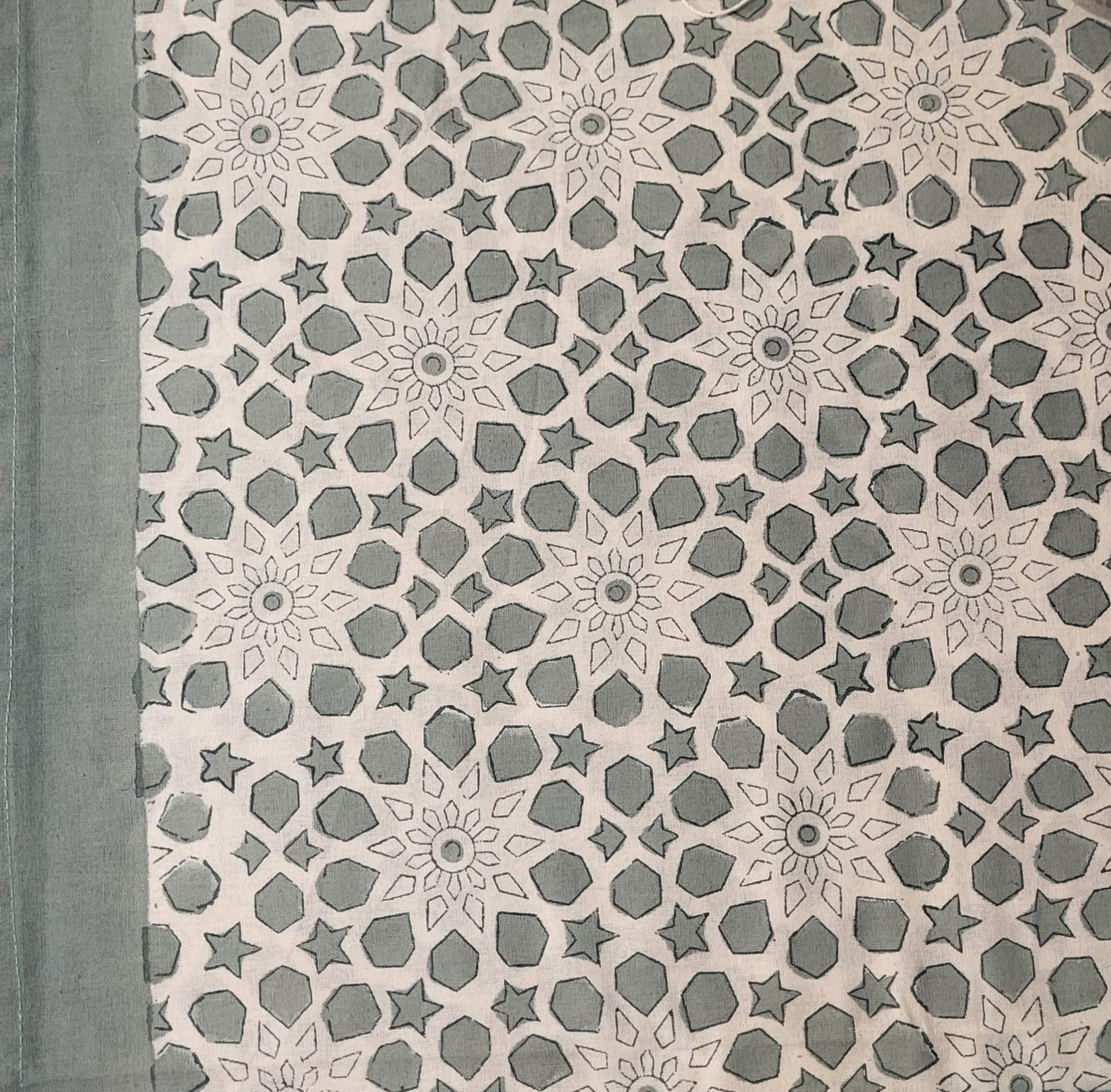 Bluey-green cotton tablecloth block-printed with floral and geometric motifs, machine washable
