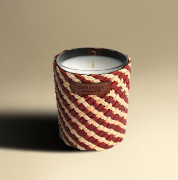 Rose oudh scented soy candle in a handwoven raffia and leather jar, 7 cm diameter, 10 cm high, 40 hour burn