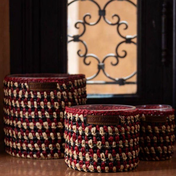Amber scented soy candle with a handwoven raphia exterior, two sizes, up to 80 hours burn time
