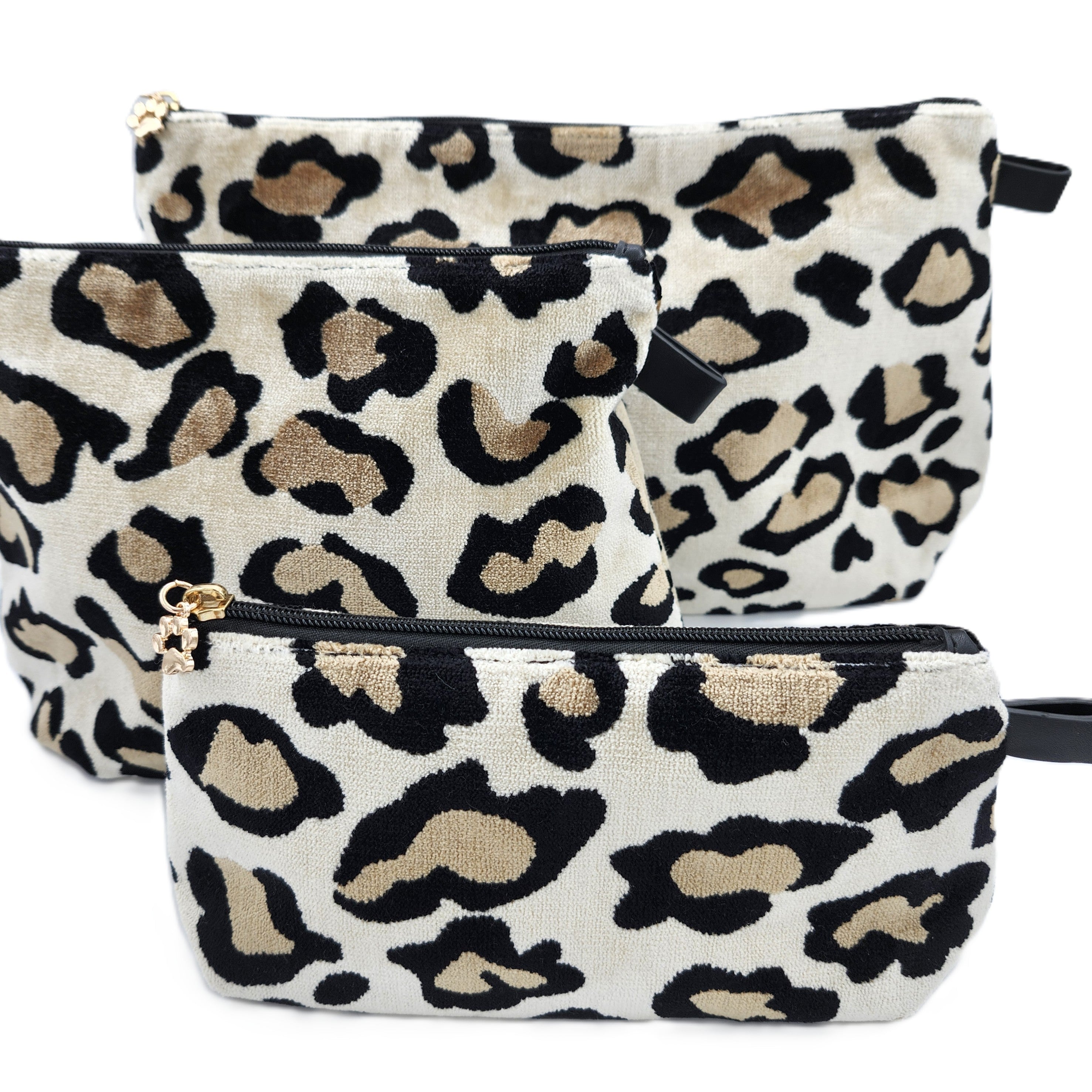 Leopard print velvet cosmetic bag with black lining and paw charm zip, available in three sizes