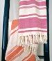 Folded view of the woven cotton beach towel, 100% cotton, quick drying and machine washable, made in India.