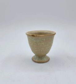 Ceramic egg cup, hand-finished tableware for serving boiled eggs at breakfast, close-up view