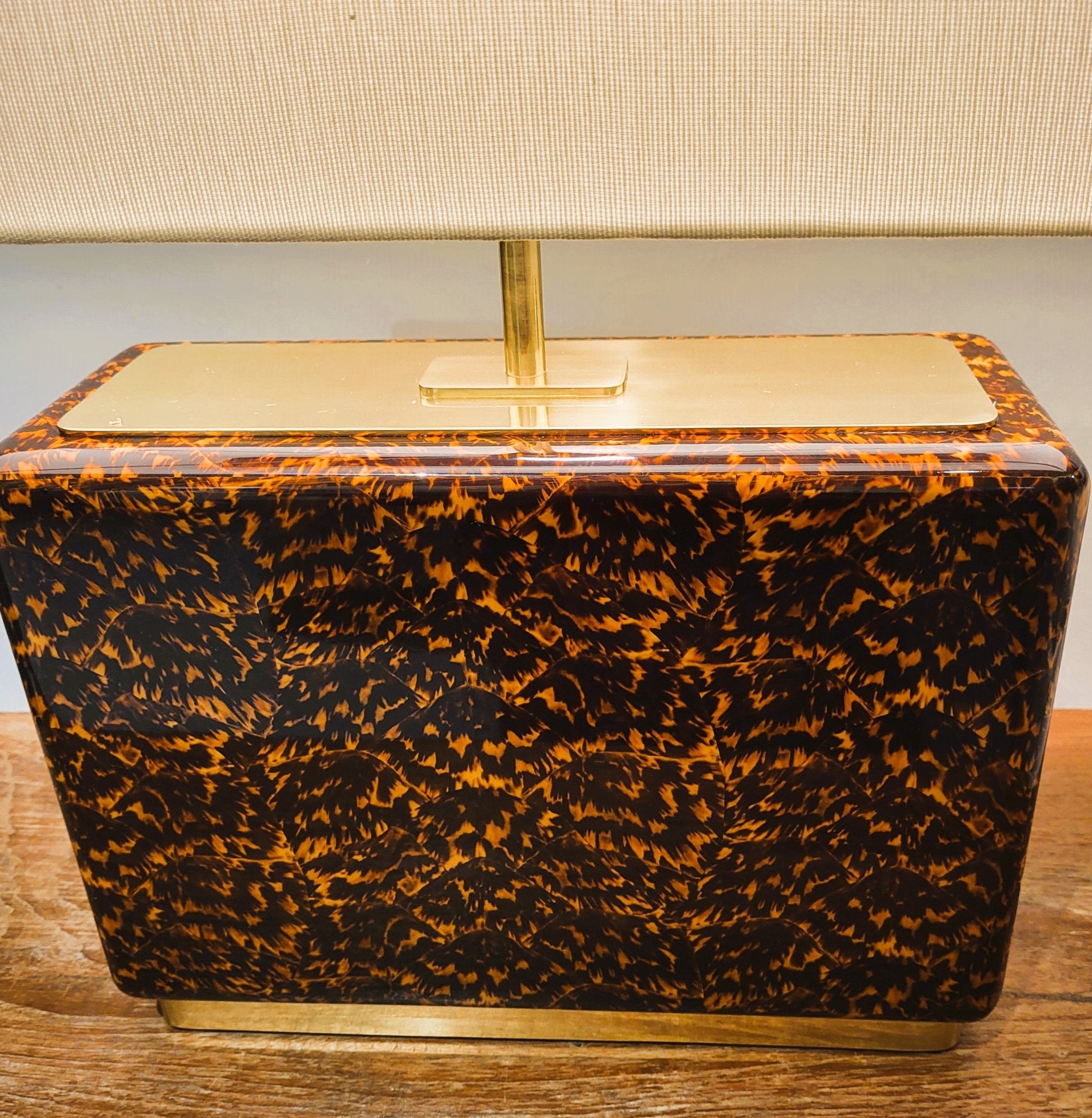 Faux tortoiseshell and brass table lamp with a cream silk shade, available in two sizes