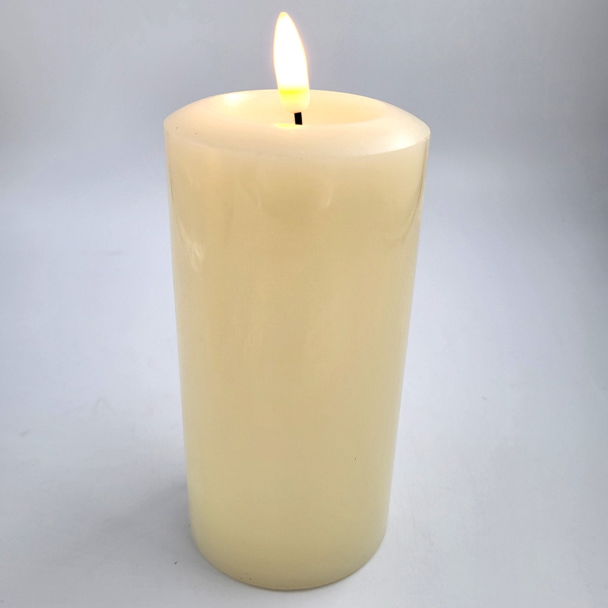 Ivory flameless LED pillar candle from Inside Living, realistic flickering battery candle for safe ambient lighting