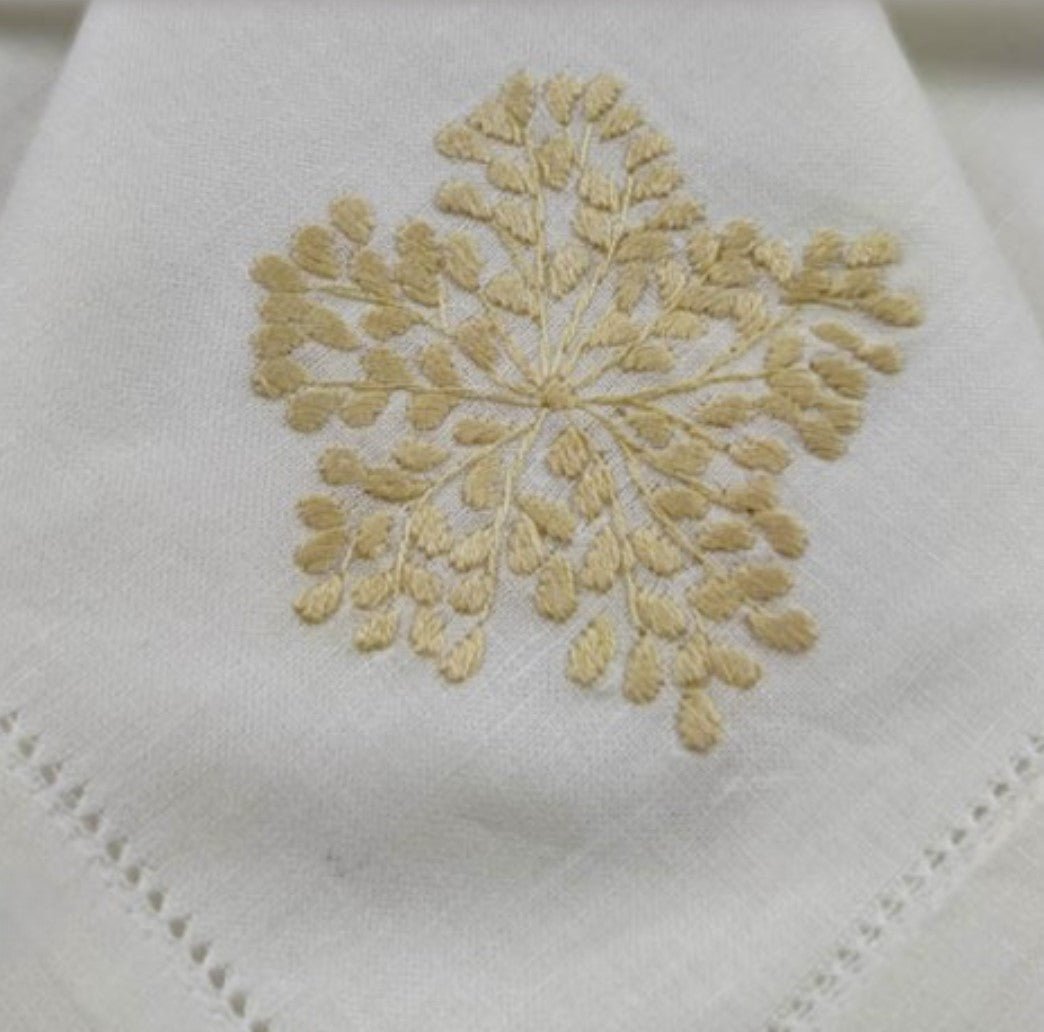 Hand-embroidered floral linen napkin in natural from Inside Living, decorative table napkin for fine dining, side view