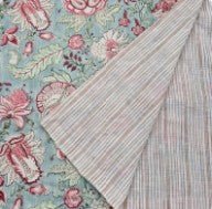 Reversible table runner with a Hibiscus block print on one side and striped cream and beige cotton on the other.
