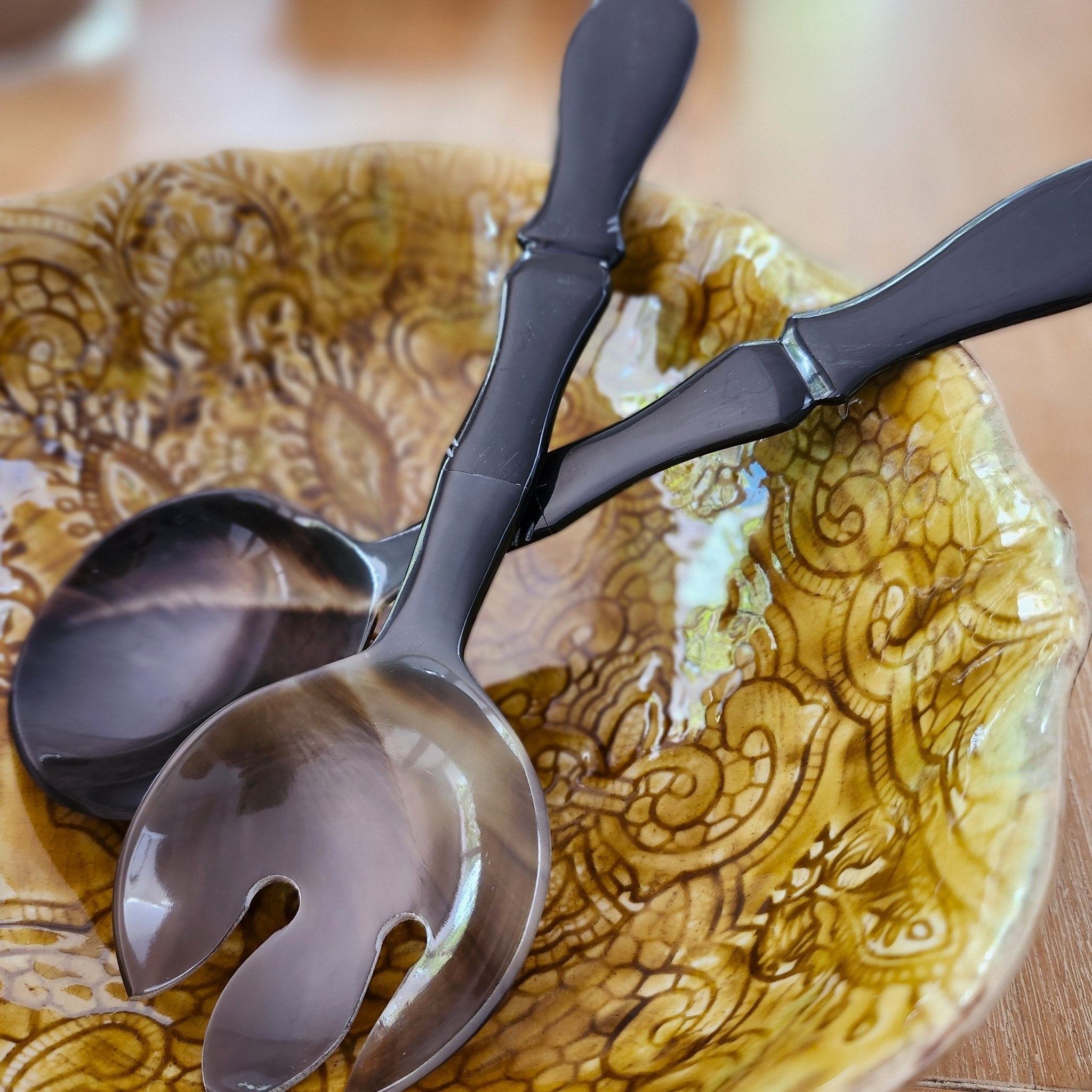Set of two salad servers handcrafted from horn with bamboo-shaped handles for scooping and serving