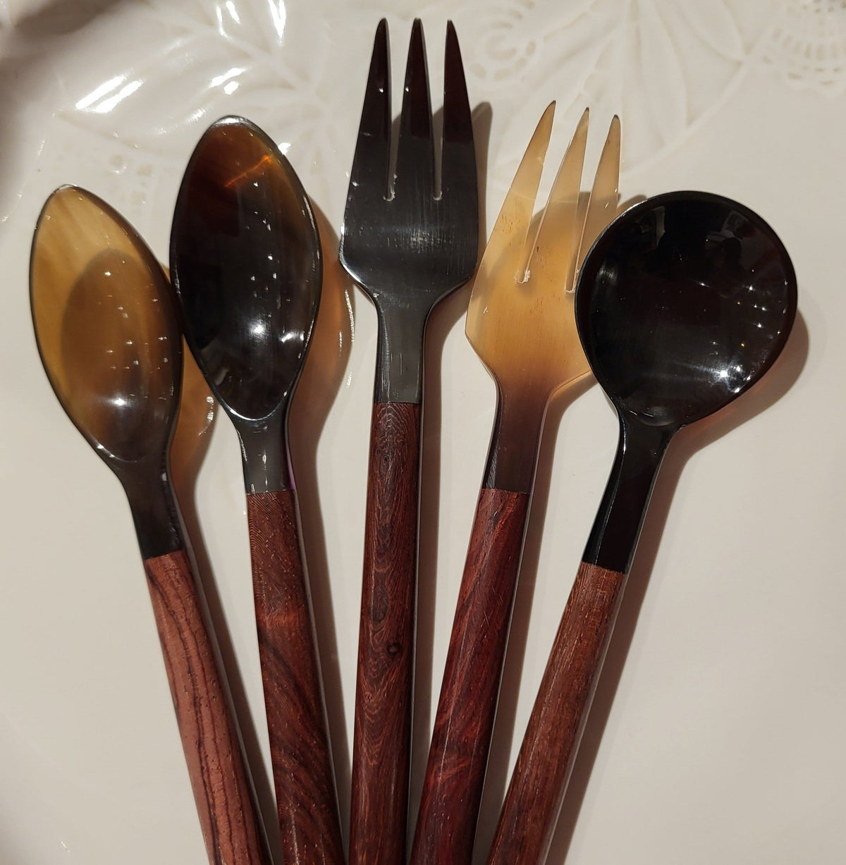Dessert or tea spoon handcrafted from horn with a plain wooden handle, approximately 14 cm long