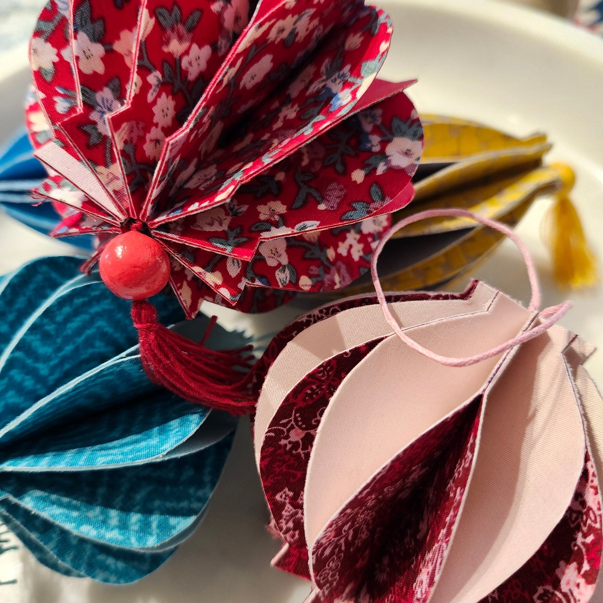 Little lanterns handmade from card and silk in assorted sizes and colours, approximately 10 cm