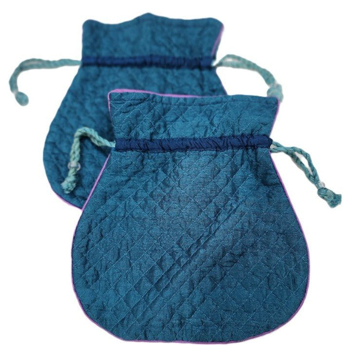 Peacock blue quilted silk pouch with a pink silk lining and string closure, 16.5 x 18cm, for jewellery or accessories.
