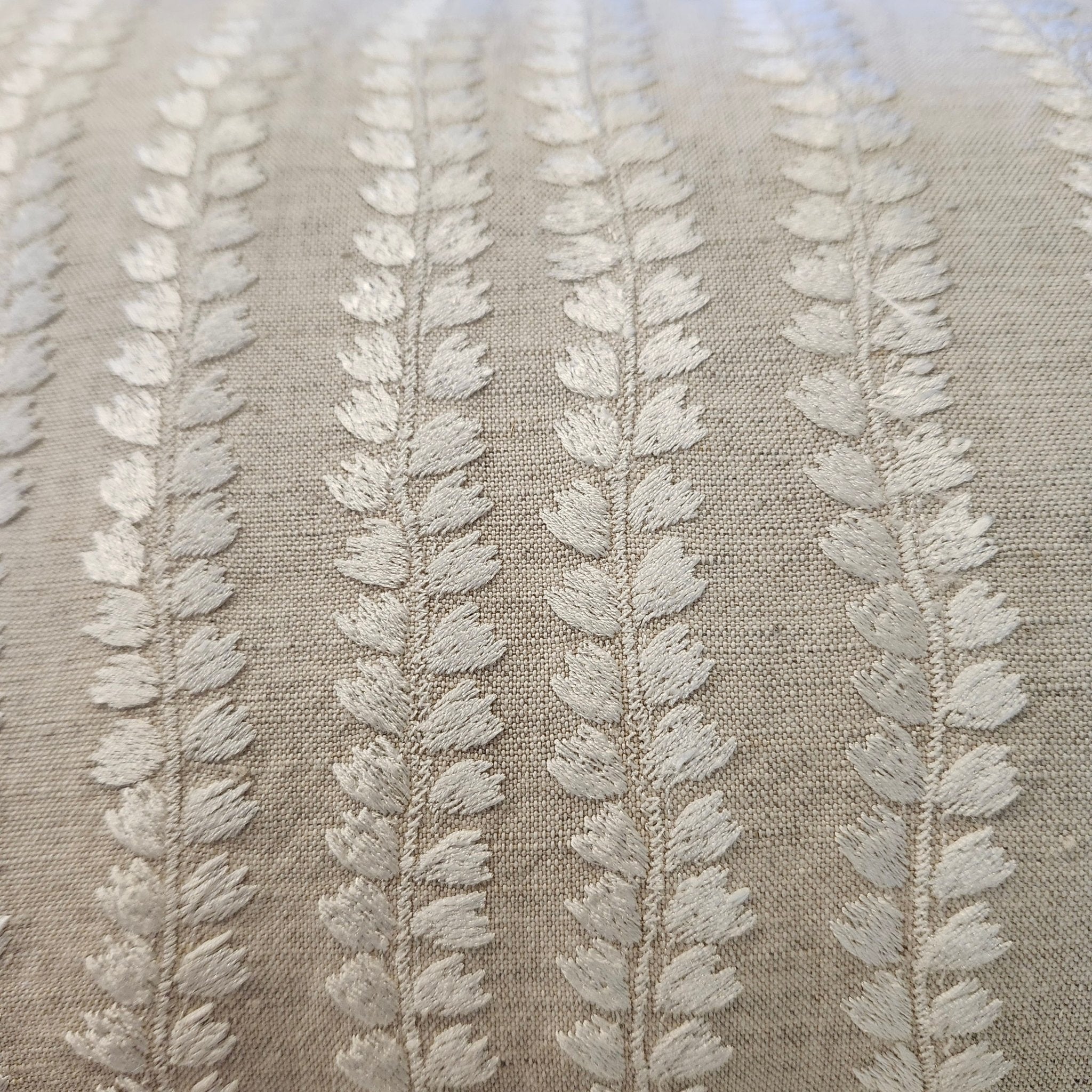 Embroidered Cushion Natural Beige, decorative cushion cover at Inside Living Singapore. Side view.