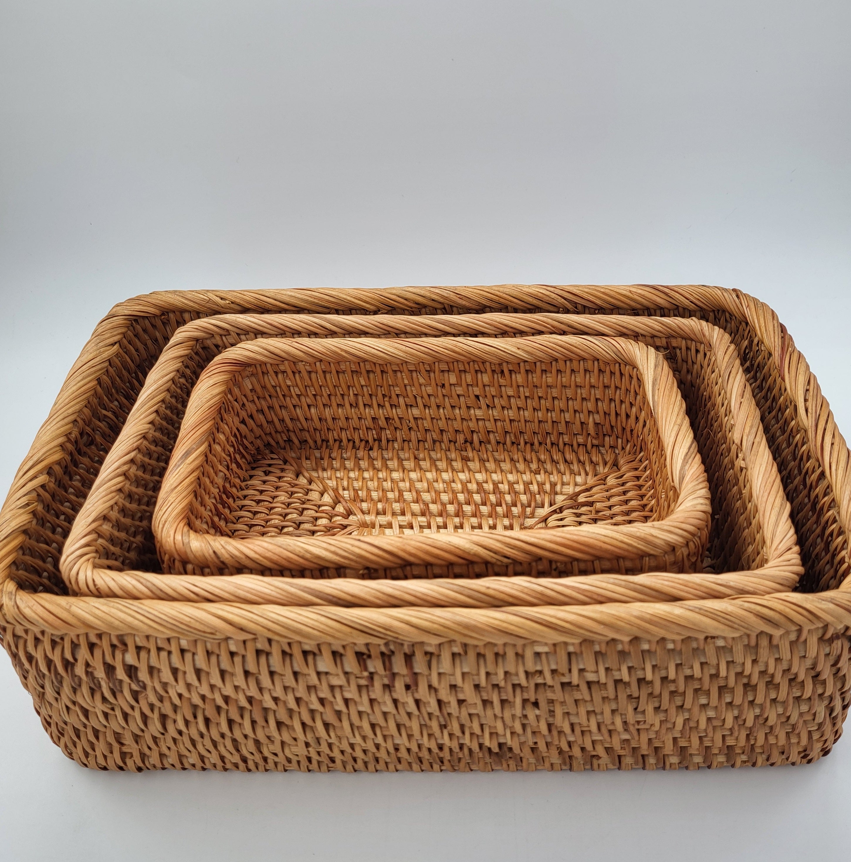 Rectangular handwoven natural rattan basket for home storage of throws, toys and household items