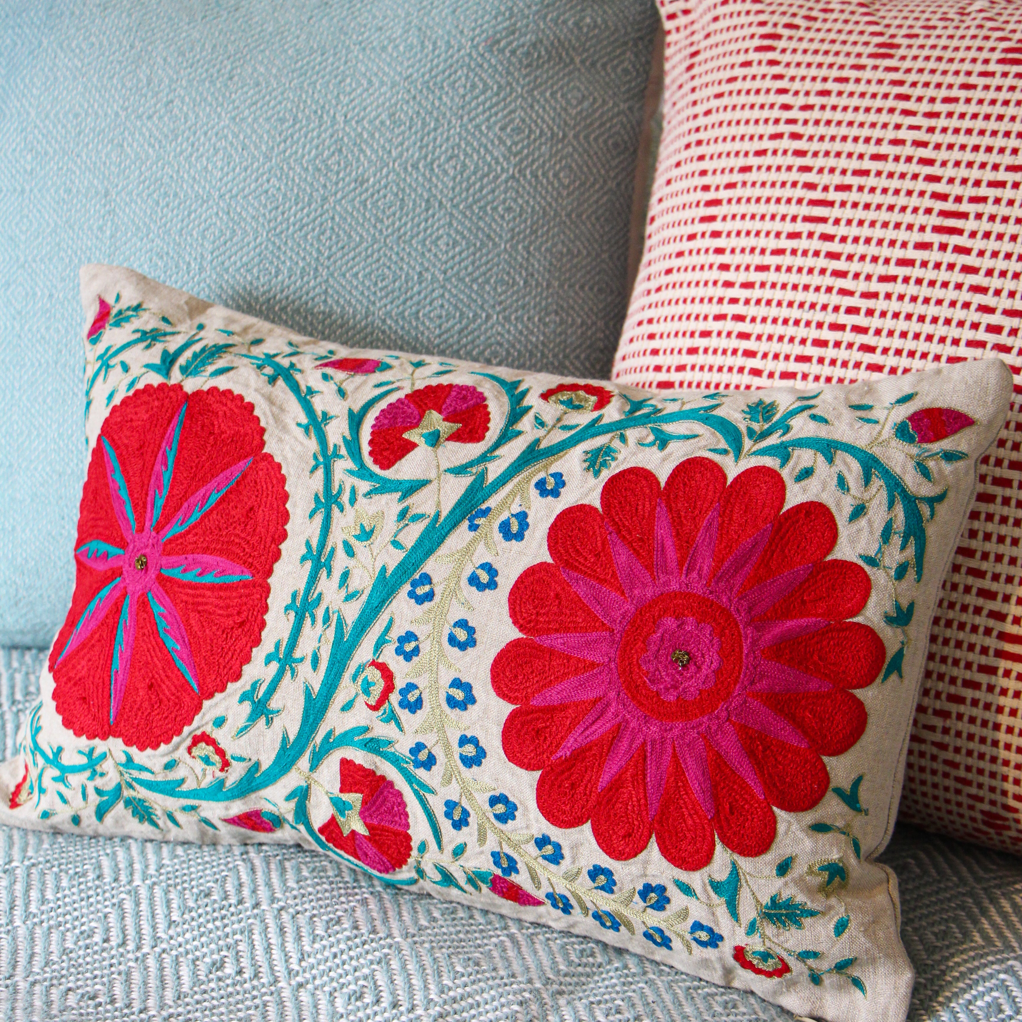 Suzani linen cushion Fergana, hand-embroidered turquoise, pink and red on natural linen, 45 x 30 cm