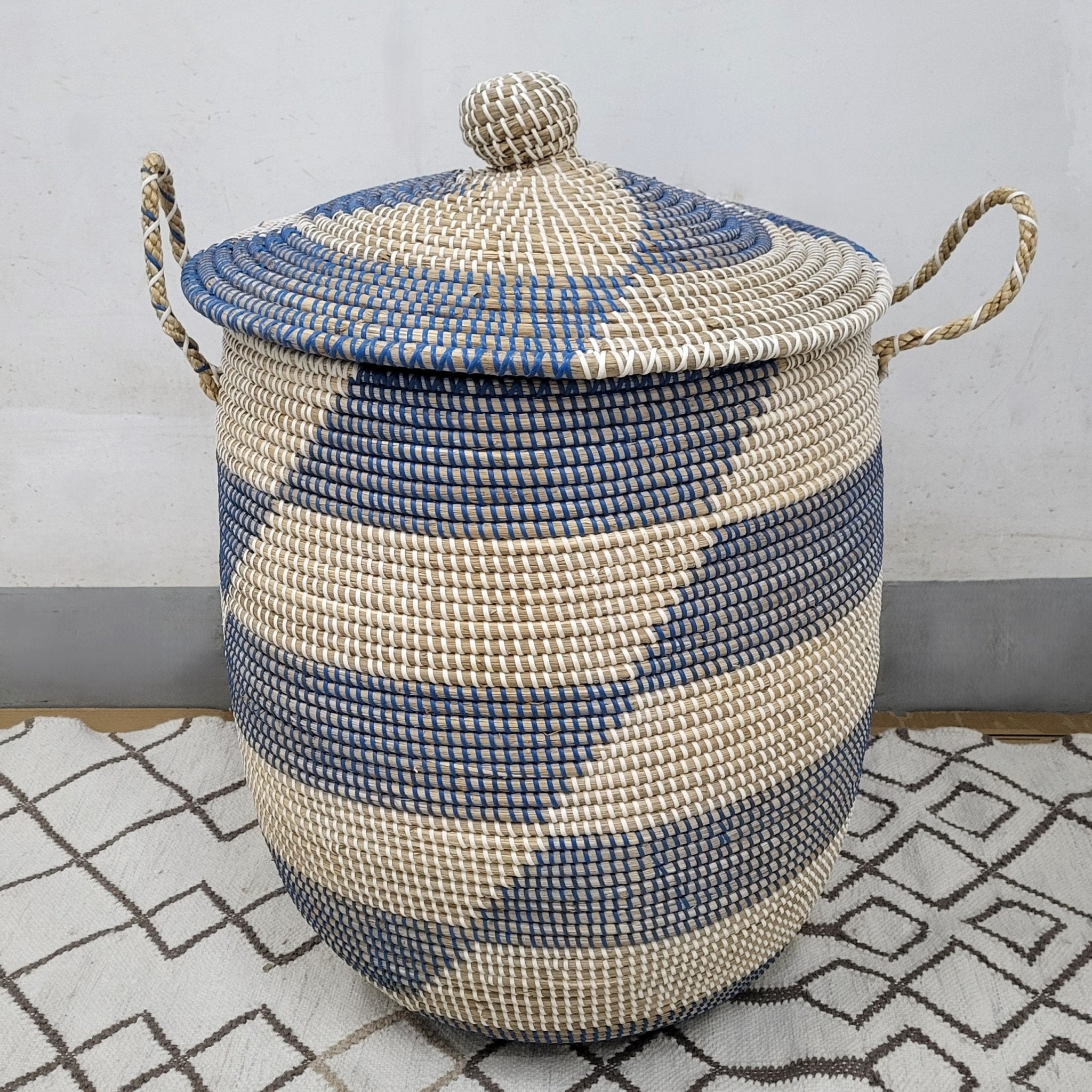 Blue seagrass laundry basket with lid from Inside Living, woven natural-fibre storage hamper for the home, side view