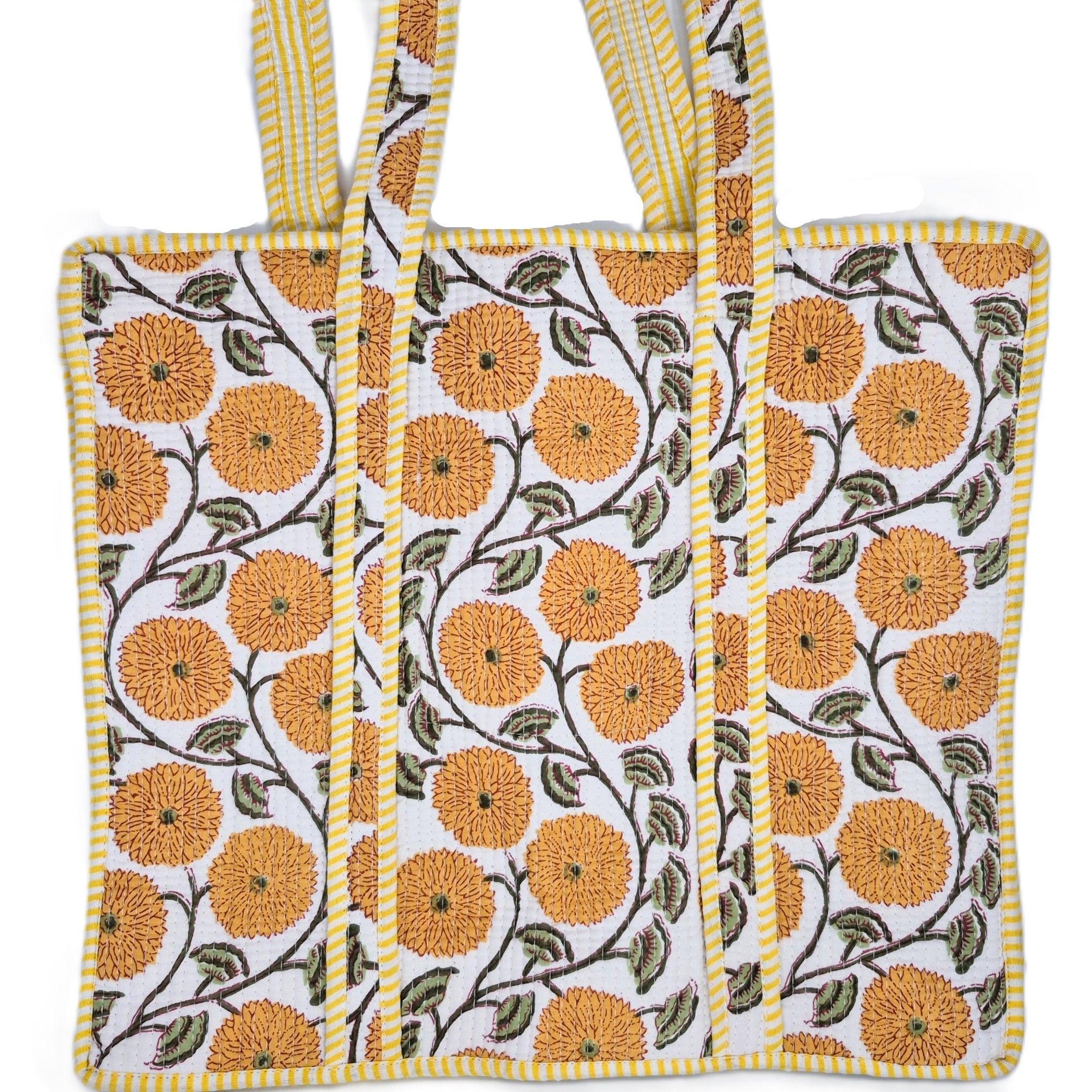 Quilted cotton shopper bag in a block-printed flower design with a contrast lining and inner pocket