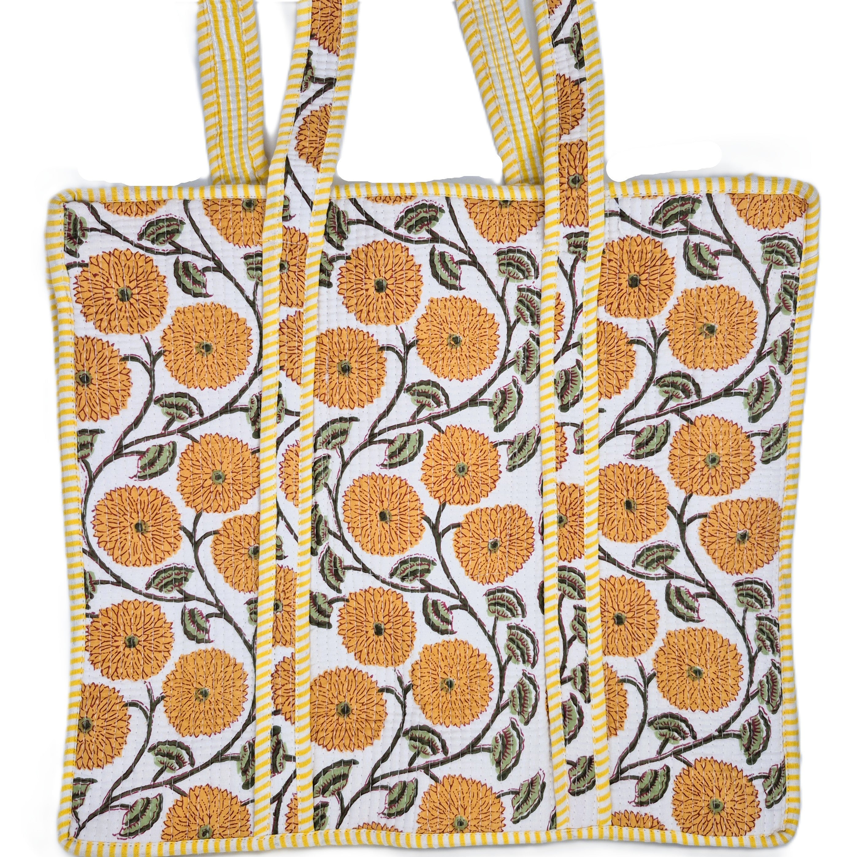 Quilted cotton shopper bag in a block-printed flower design with a contrast lining and inner pocket