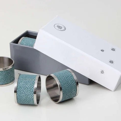 Set of 4 napkin rings in teal faux shagreen with stainless steel, 5 cm across for a dressed dining table