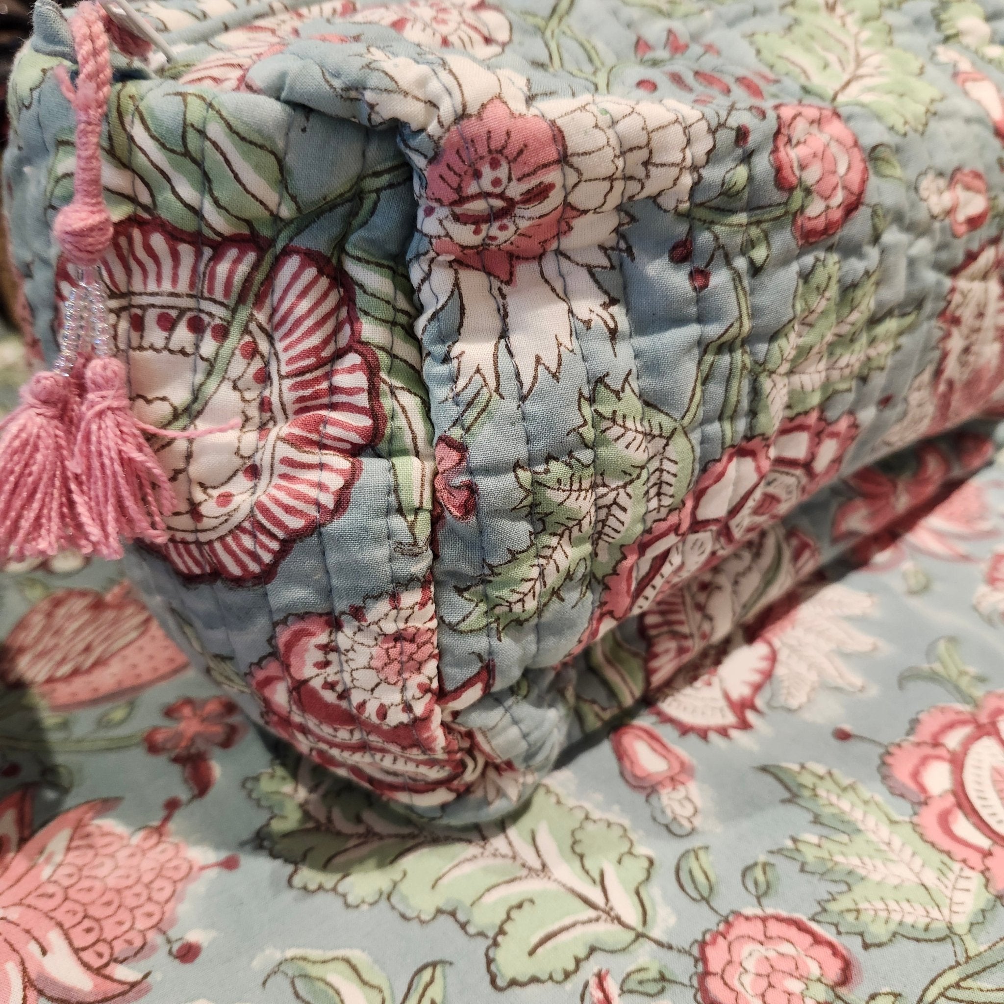 Block print cotton wash bag in hibiscus design, handmade toiletry and travel pouch for bathroom essentials, close-up view