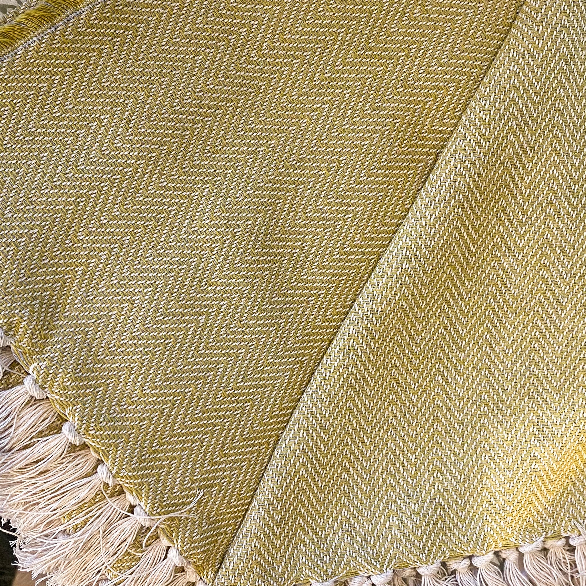 Reversible Cotton Throw, shown in context, from the Inside Living Singapore homeware collection.