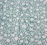 Reverse side of the Floral Green block print table runner, showing the striped cream and turquoise weave.