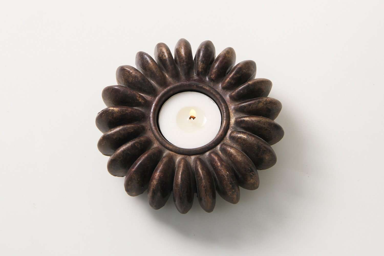 Tea light holder cast from a sandbox seed pod in resin, bronze finish, 12 x 12 cm for table or kitchen