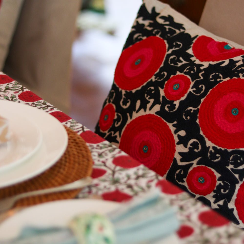 Linen suzani cushion cover in red and black with hot pink and a turquoise centre, 45 x 45 cm
