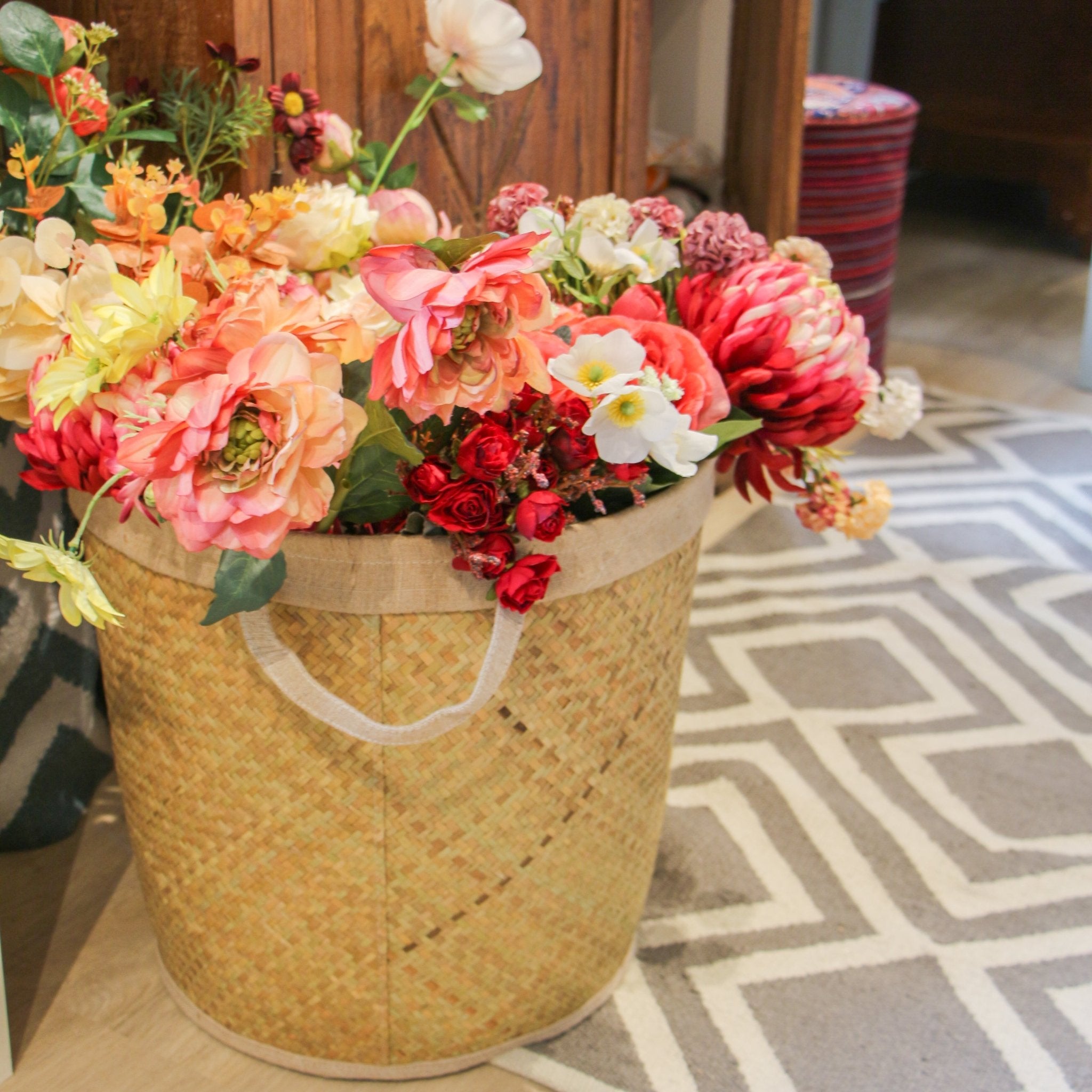 Handwoven seagrass laundry basket with handle, natural rustic storage basket, available in two sizes.
