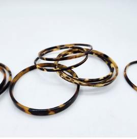 Slim bangle made from natural buffalo horn with unique markings ranging from tortoiseshell to leopard