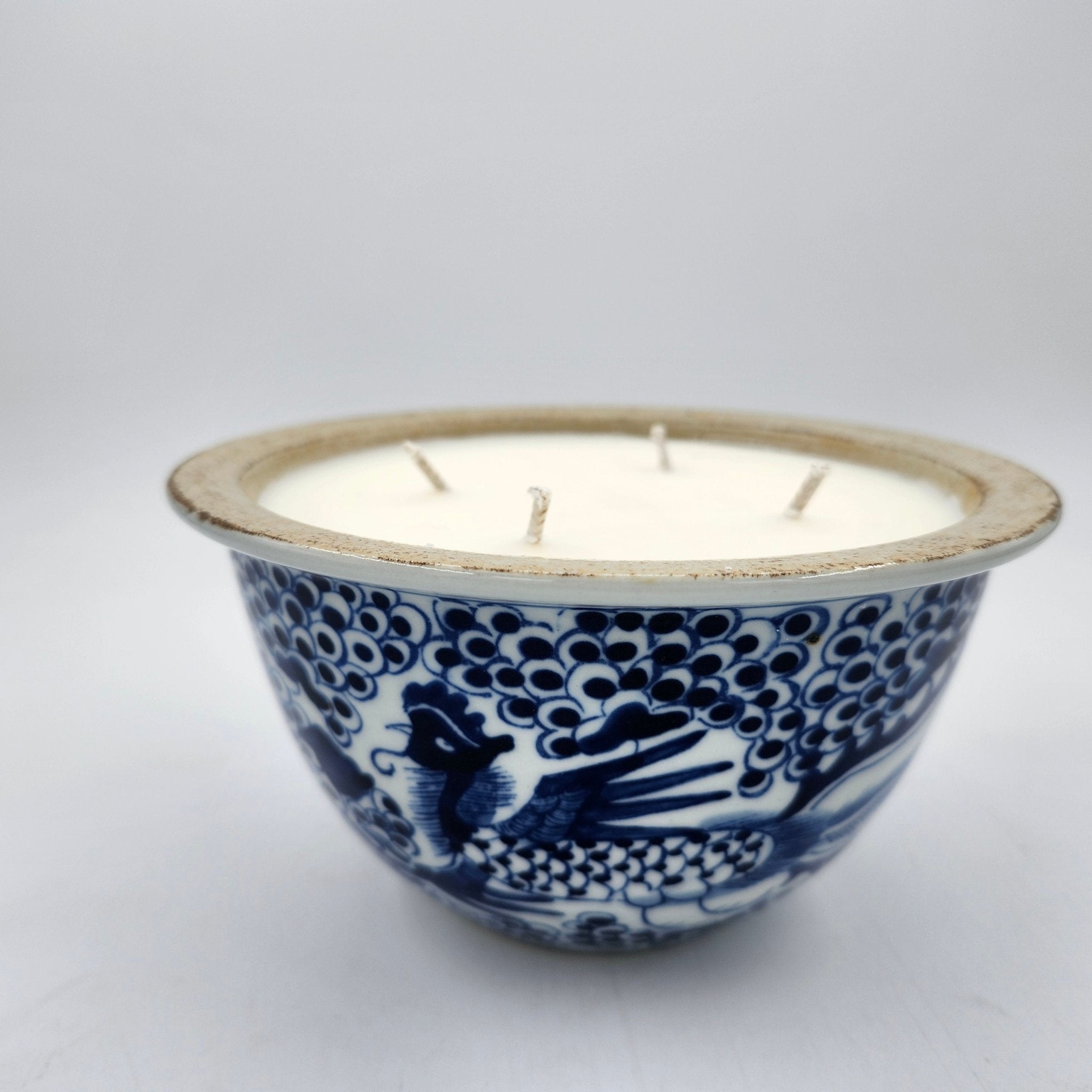 Blue and white scented candle with a phoenix design, organic soy wax with four wicks, neroli and bergamot scent