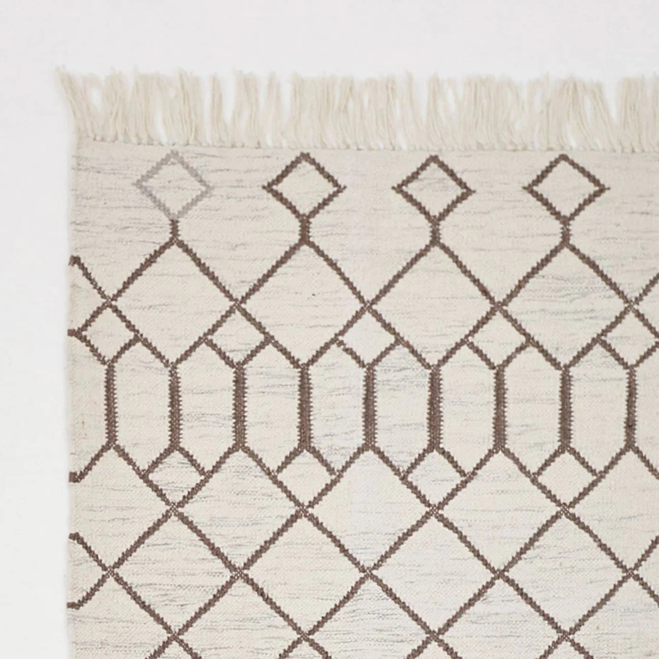 Tangier Medina rug corner detail, woven patterned rug with an intricate Moroccan-style design for the home.