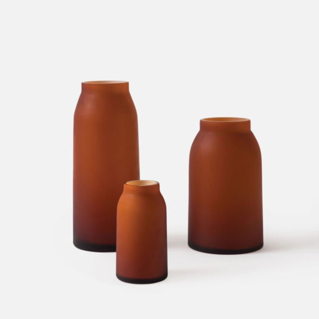 Hand-blown amber glass Otto vase with a warm colour and matte finish, each piece uniquely made