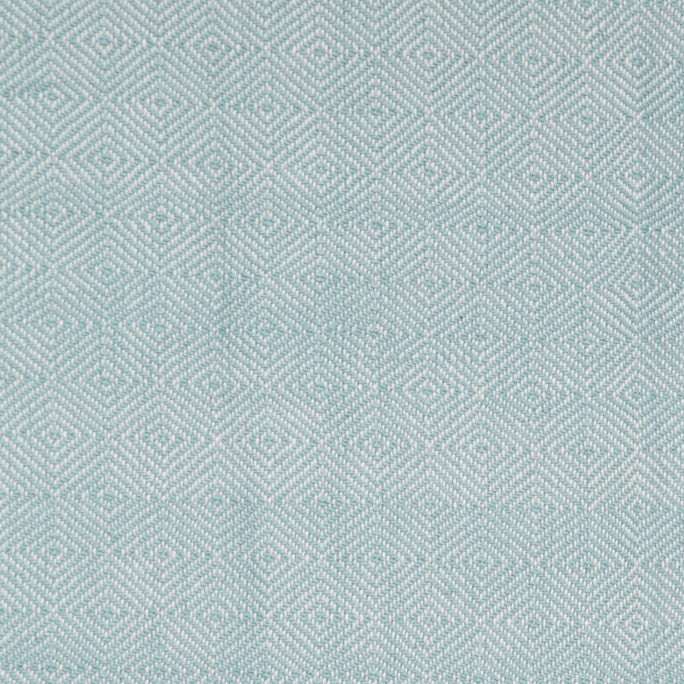 Teal diamond blanket detail, woven geometric throw in teal adding cosy texture and colour to seating.