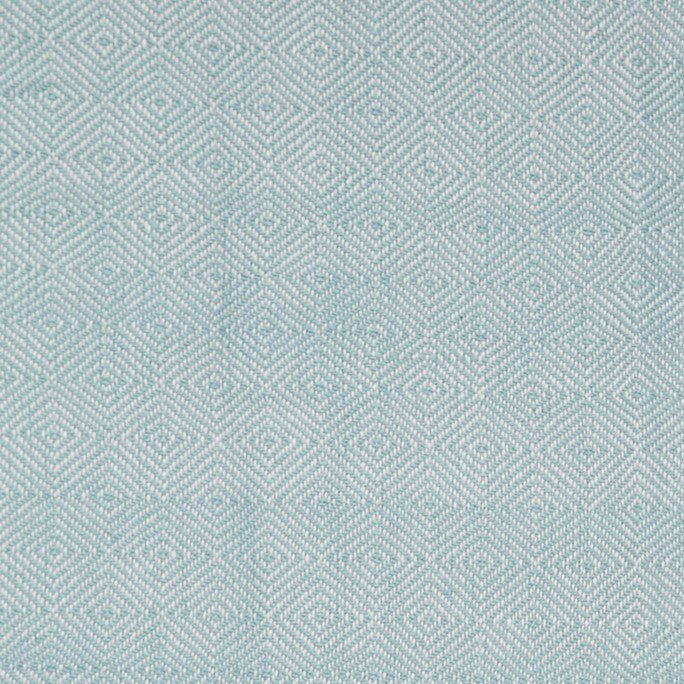 Teal diamond blanket detail, woven geometric throw in teal adding cosy texture and colour to seating.