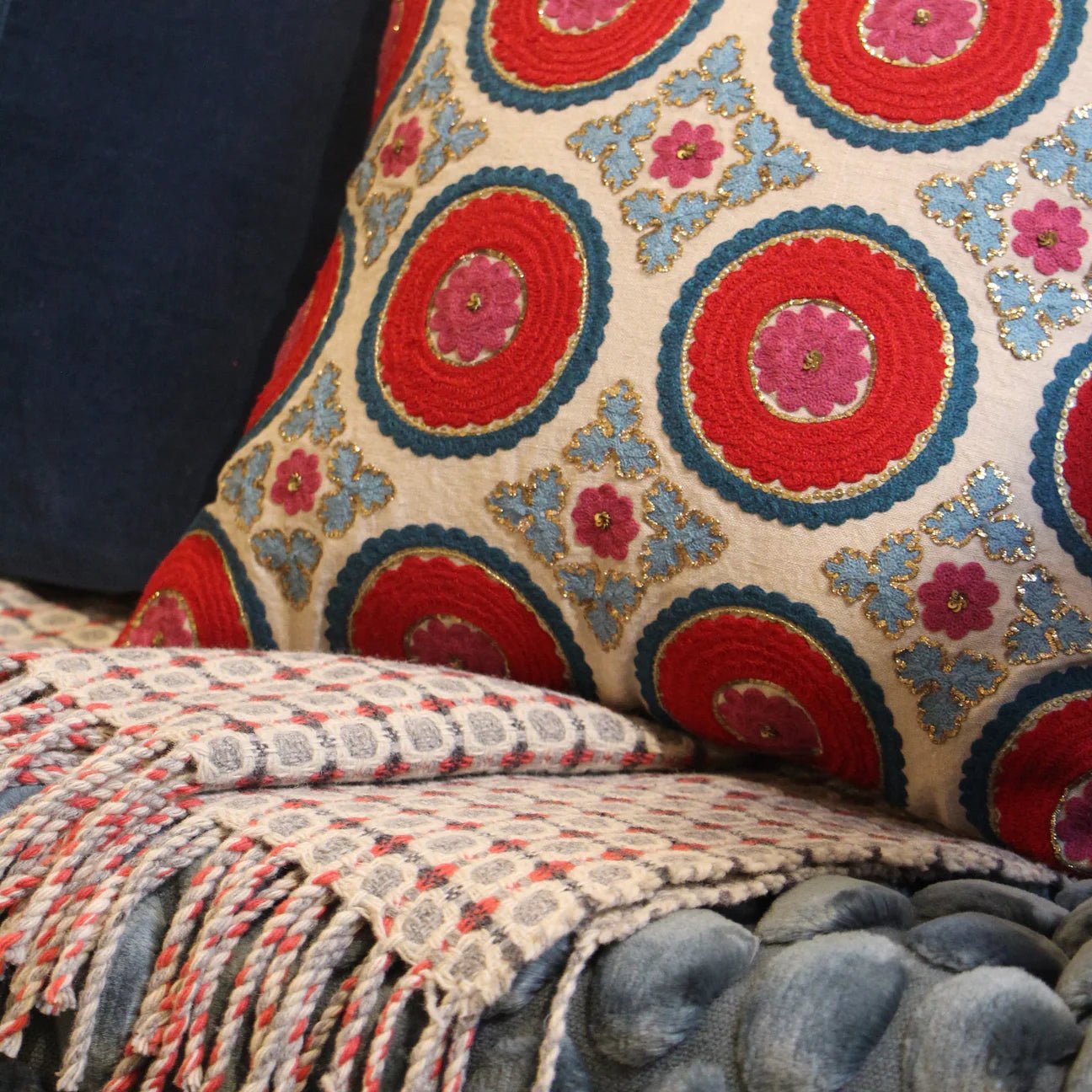 Suzani Kokand cushion in red linen, 45 x 45 cm, hand-embroidered in red, teal and turquoise with gold sitara stitching