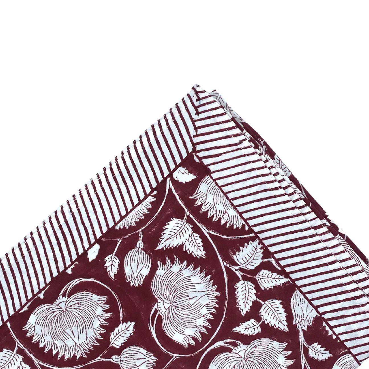 Block-print cotton tablecloth in burgundy lotus design, 170 x 270 cm, from Inside Living Singapore Side view.