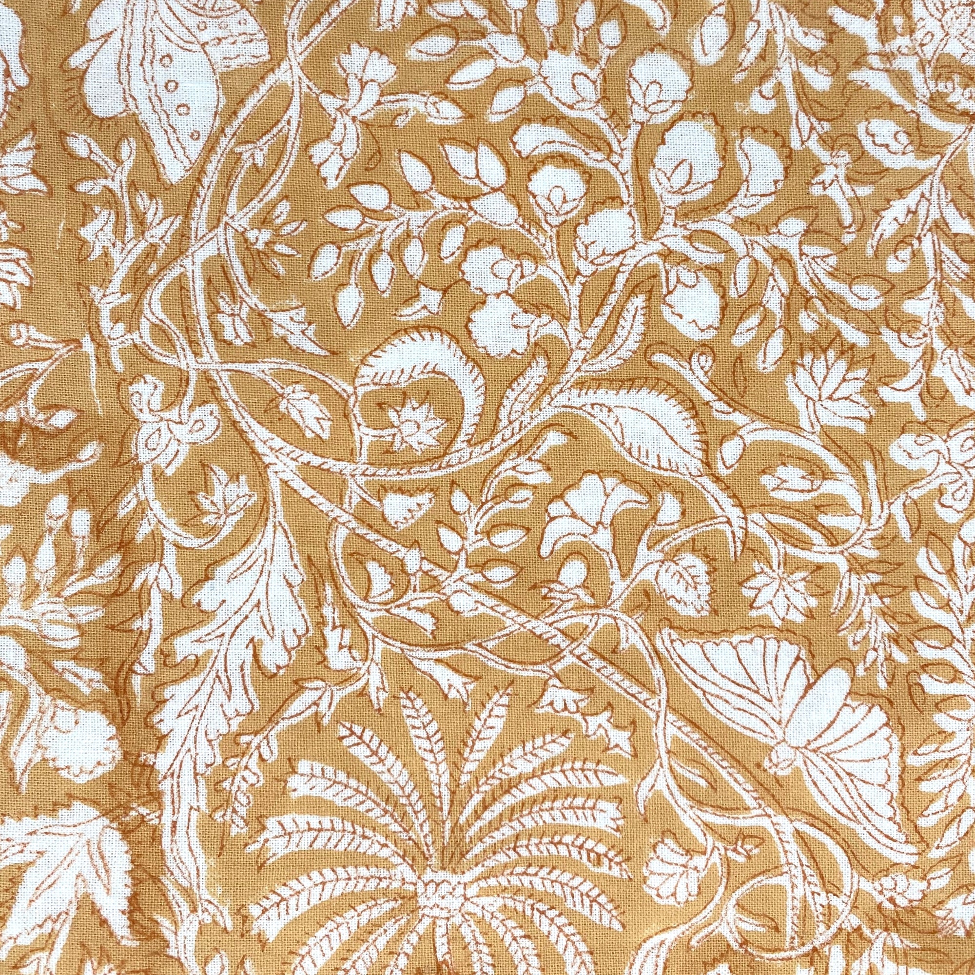Yellow cotton tablecloth in the Rainforest block print with a striped border, machine washable