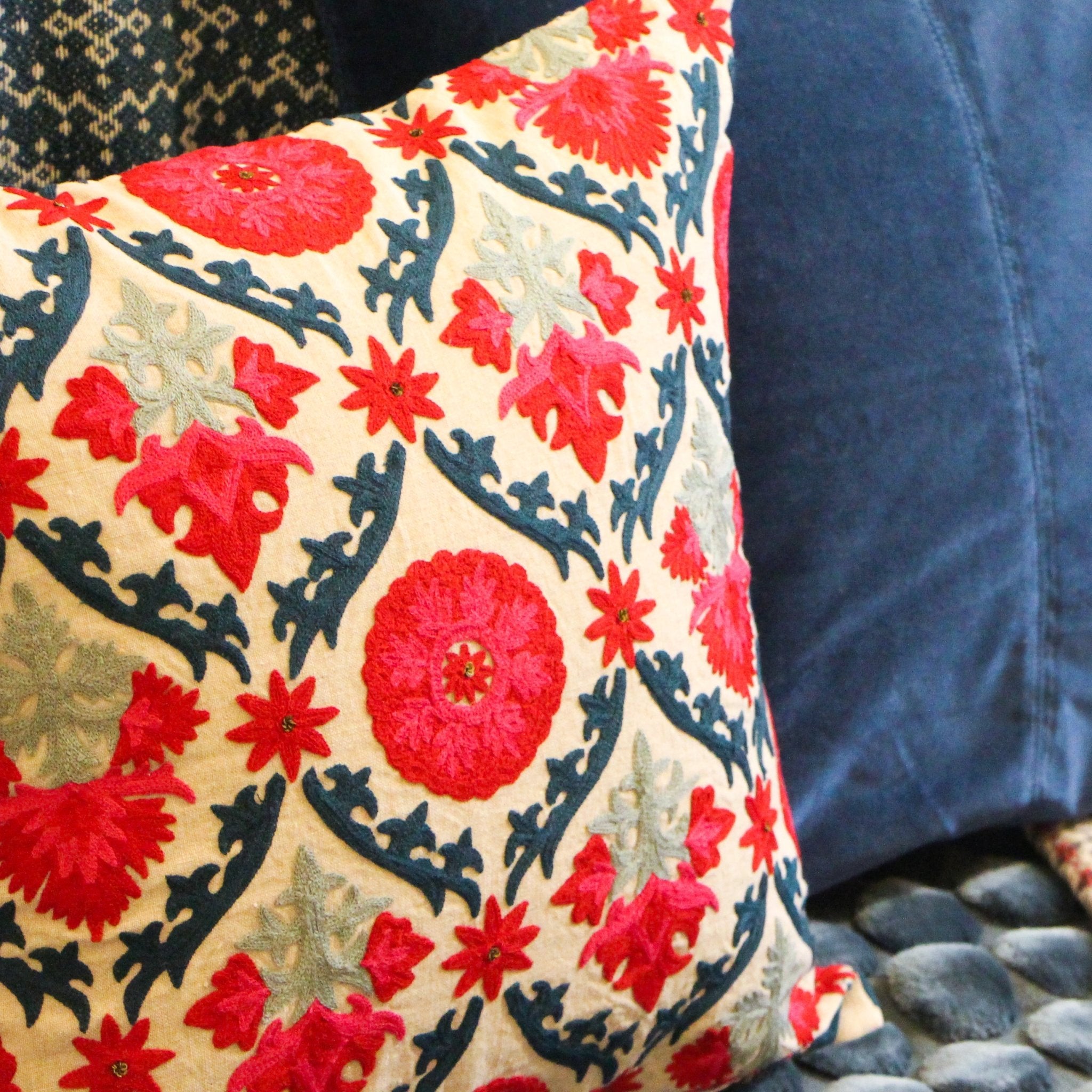 Suzani Niksaar linen cushion in red and blue with embroidered detail, from Inside Living Singapore Detail view.