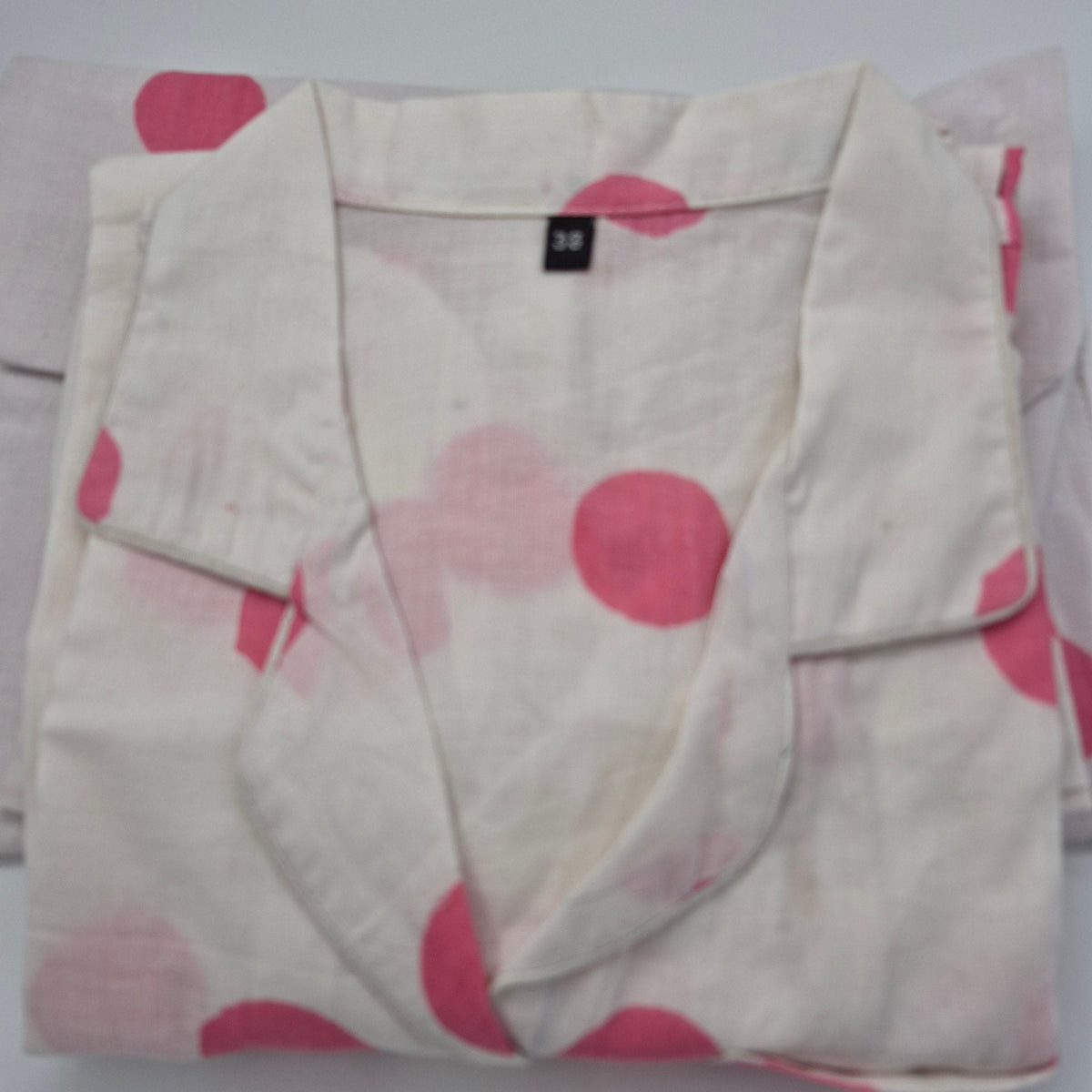 Gifts under $100 banner showing a block print cotton pyjama short set with its matching drawstring bag.
