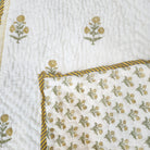 Yellow marigold block print child's quilt, machine washable, made from fine organic cotton cambric for a cot or bed
