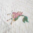 Child's block print quilt with a mermaid on one side and a contrast yellow pattern on the other, organic cotton
