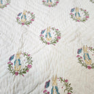 Child's block print quilt with a Peter Rabbit print, made from fine organic cotton cambric and machine washable